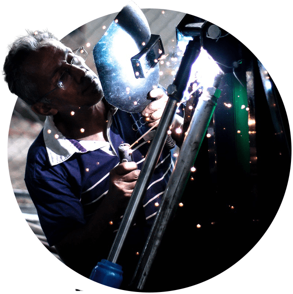 a welder holding a welder equipment shield