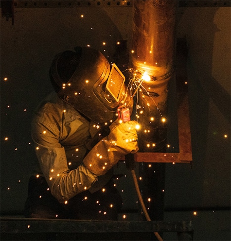 a man using WSE welding equipment